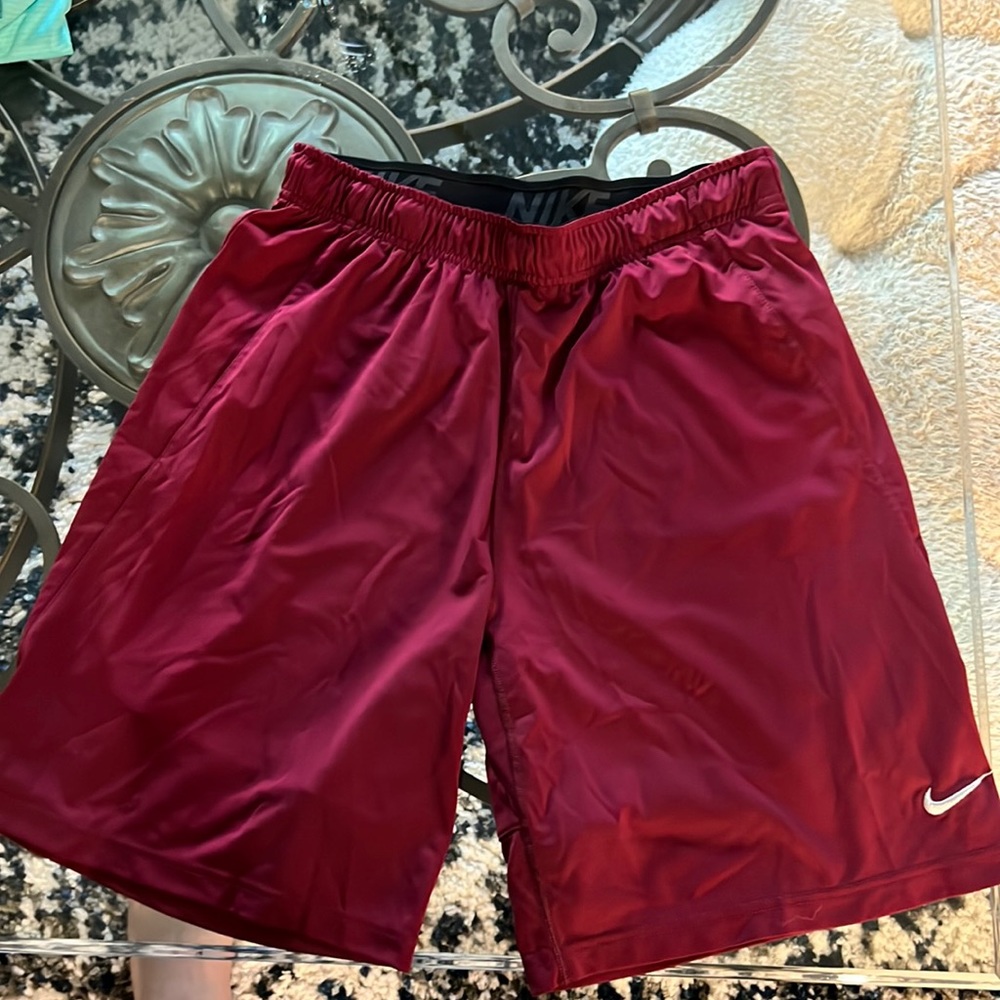 Men’s Nike shorts, Large in size, maroon in color.